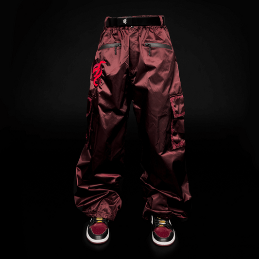 Baggy ruby snowpants, ideal for snowboarding and skiing. These are durable, and waterproof pants.  showcasing a stylish look for both ski and snowboard enthusiasts. Perfectly crafted to combine fashion and function, these baggy ski pants ensure comfort and mobility on the slopes.